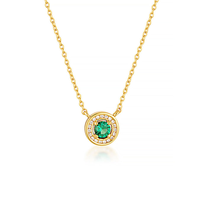 MILESTONE EMERALD HALO PENDANT IN GOLD